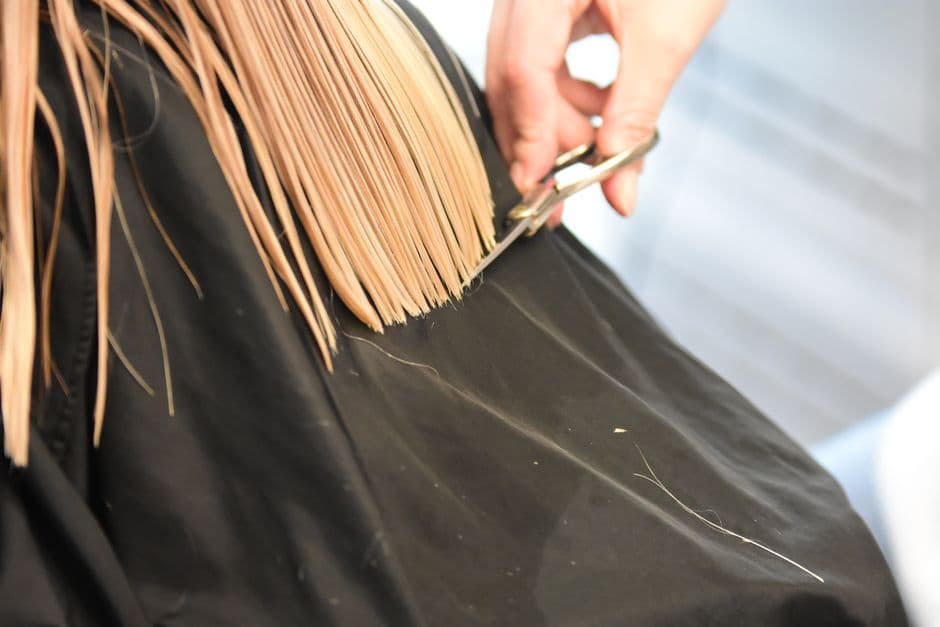 A hairdresser cutting a client’s hair