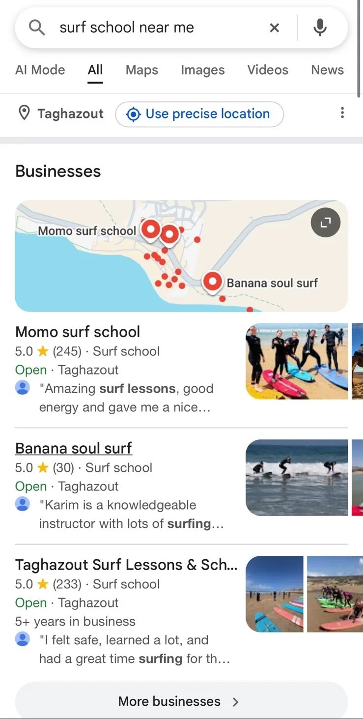 A real Google search on a phone for surf school near me in Taghazout, showing the map with pins and the three businesses listed underneath